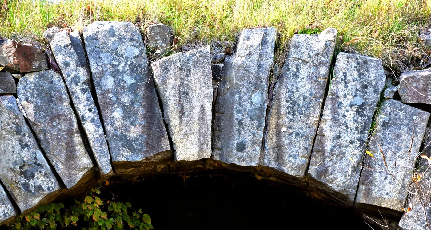 Stone arch held together by a central keystone