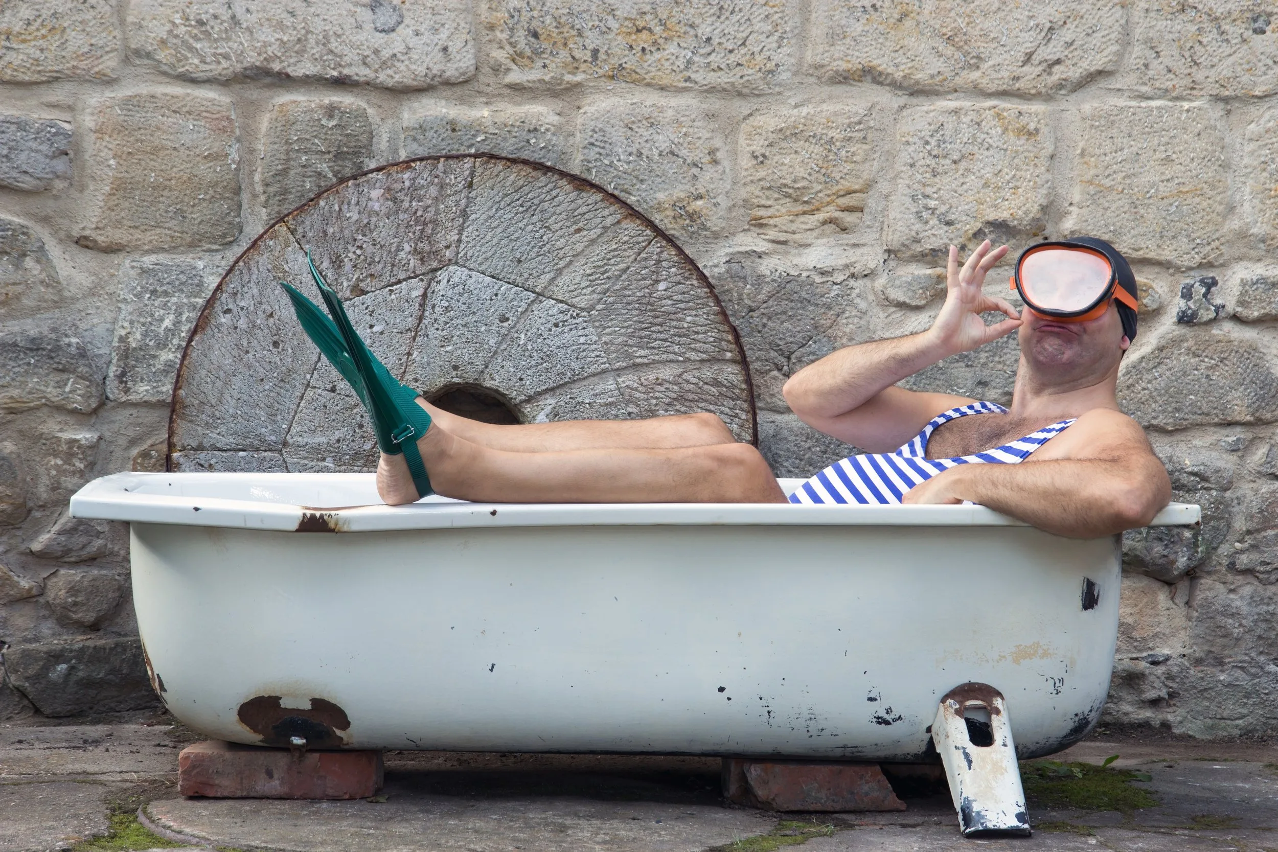 Person being baptized in water