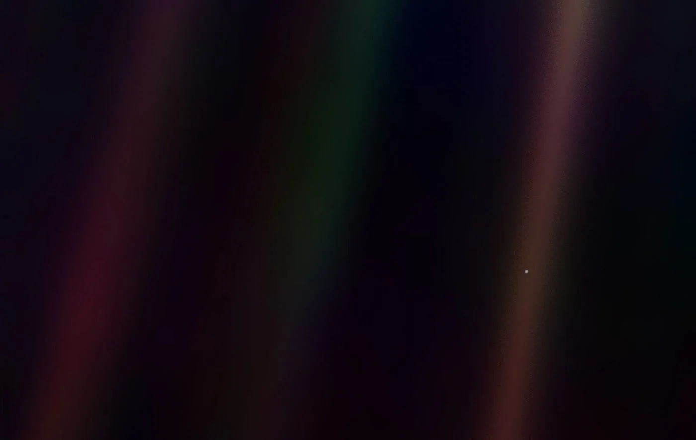 Earth as a pale blue dot in space