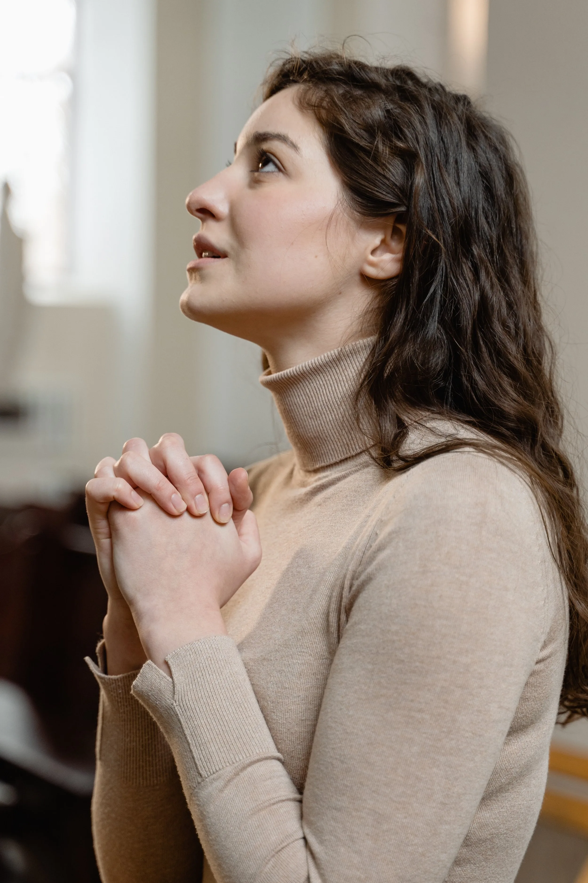 Woman praying in church